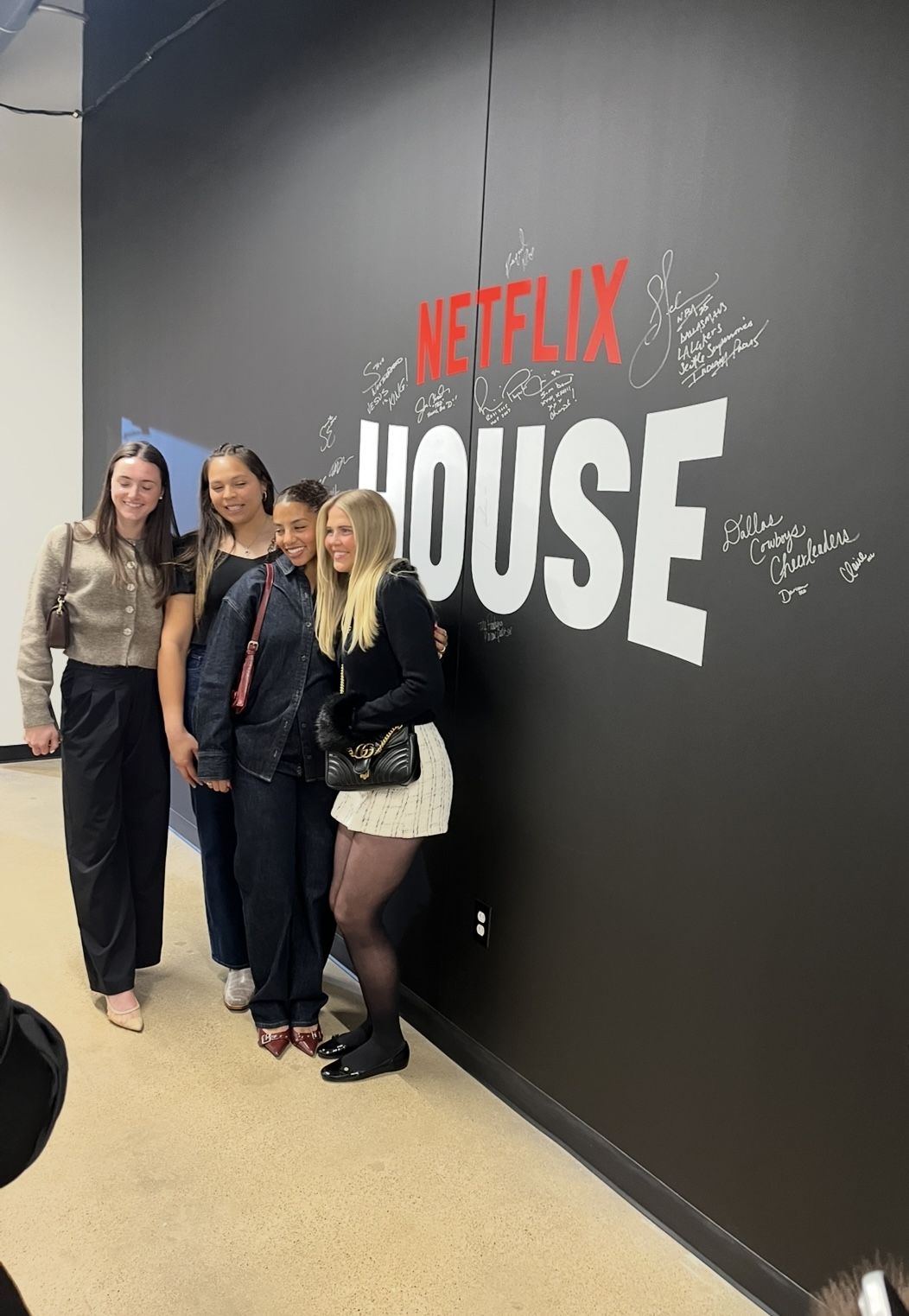 Dallas Trinity FC's Lucy Shepard, Cyera Hintzen, Cam Lancaster, Lexi Missimo Pose With Netflix Houses Signature Wall - 1